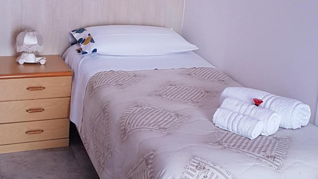 Łóżko lub łóżka w pokoju w obiekcie B&B Regina Elena