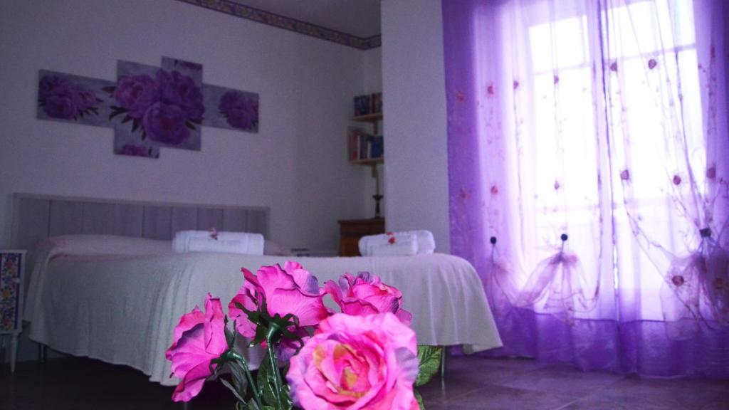 Łóżko lub łóżka w pokoju w obiekcie B&B Regina Elena