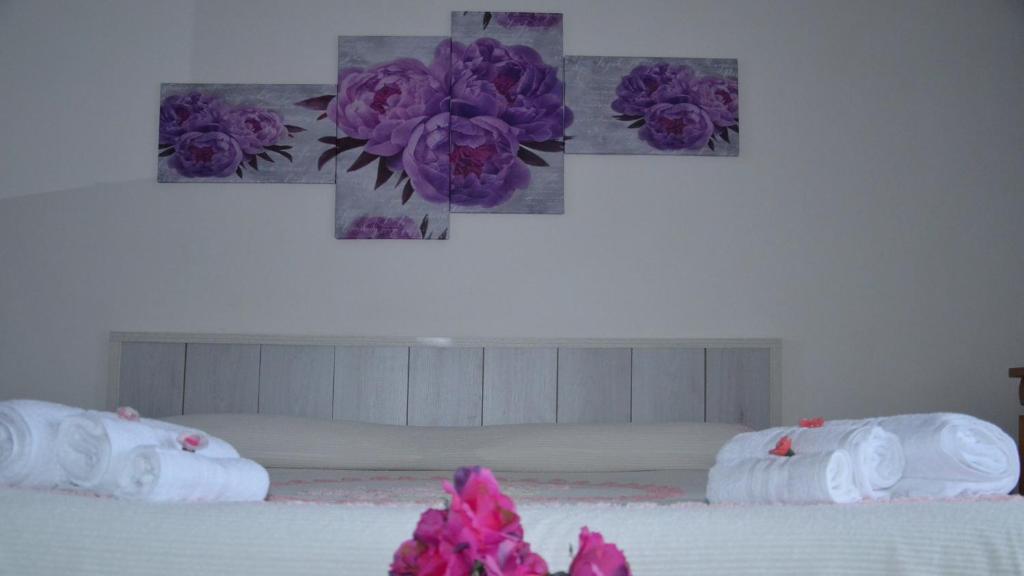 Łóżko lub łóżka w pokoju w obiekcie B&B Regina Elena