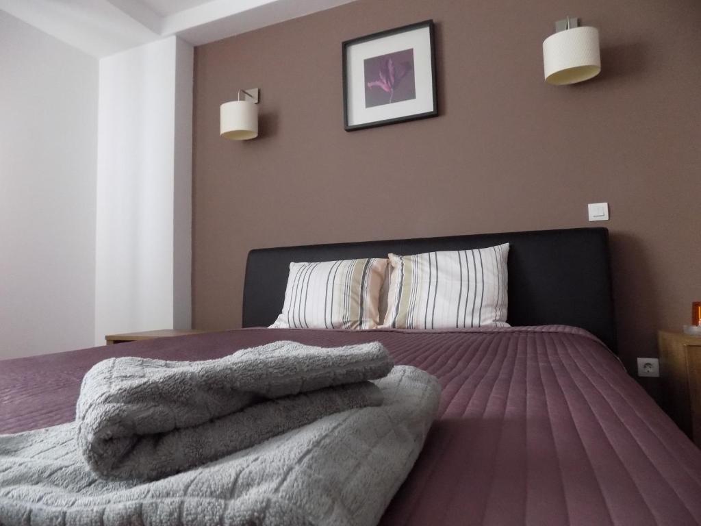 Postel nebo postele na pokoji v ubytování Colosseum Residence