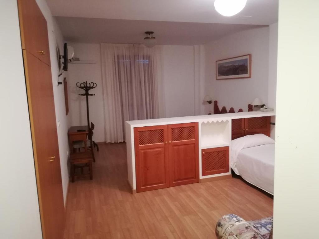 Postel nebo postele na pokoji v ubytování Hotel Andalucia
