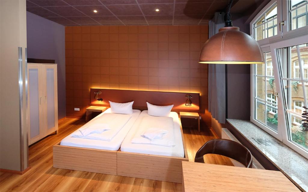 Postel nebo postele na pokoji v ubytování Singer109 Hostel, Hotel & Apartment