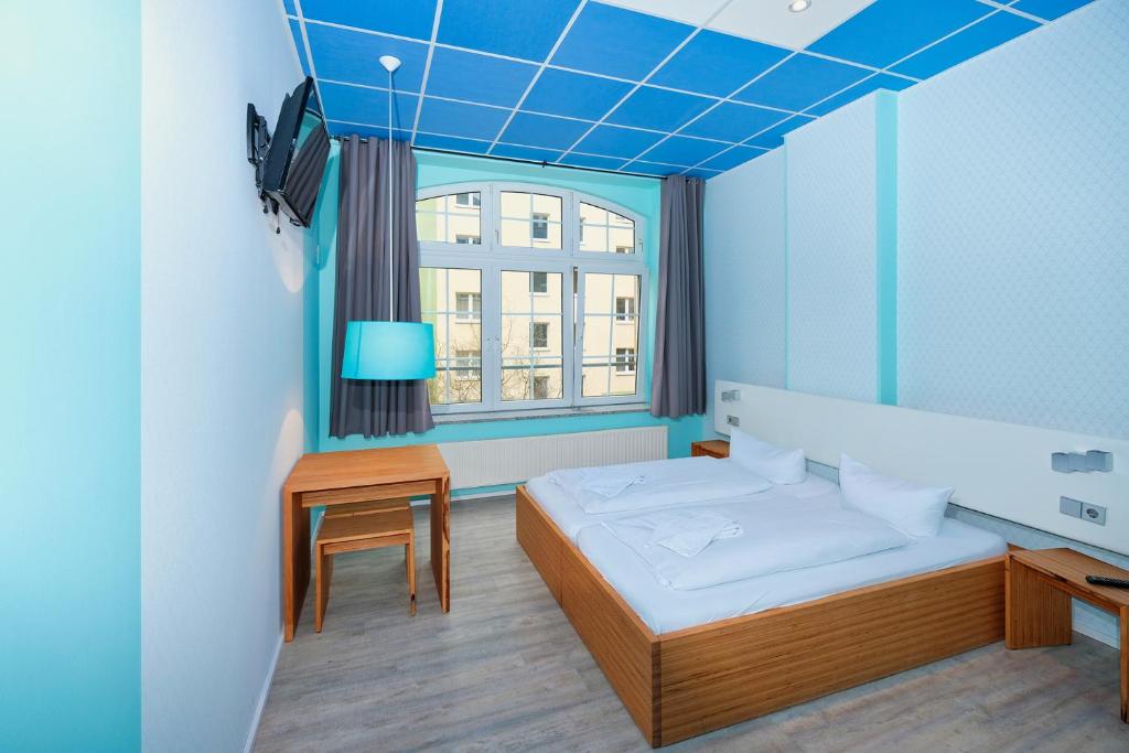 Postel nebo postele na pokoji v ubytování Singer109 Hostel, Hotel & Apartment
