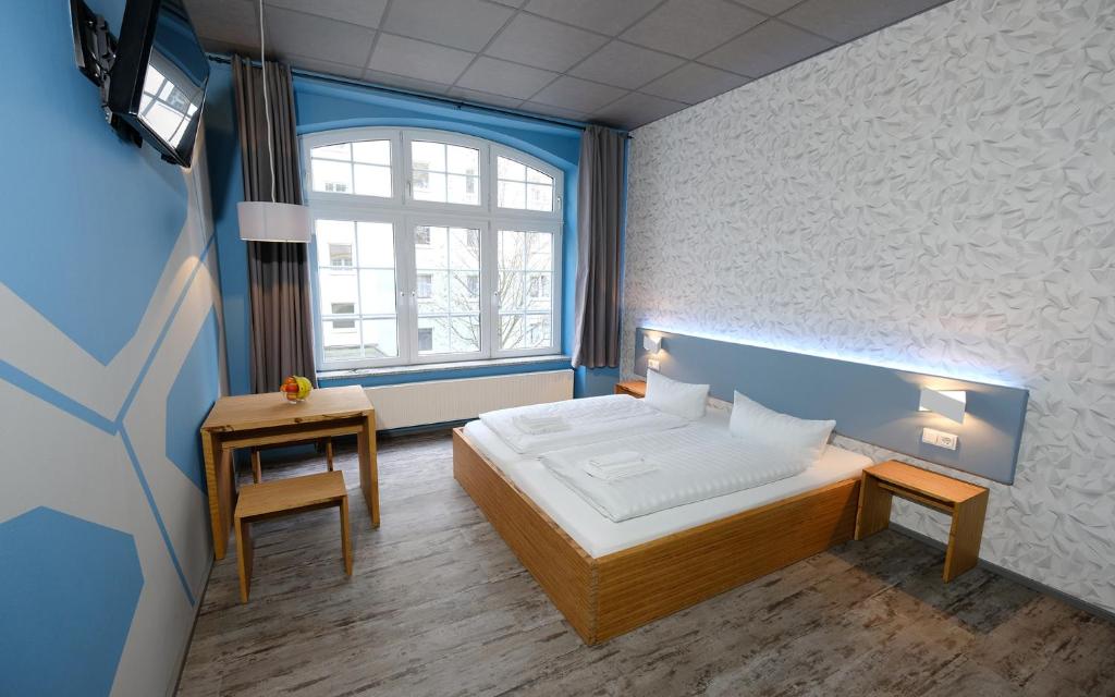 Postel nebo postele na pokoji v ubytování Singer109 Hostel, Hotel & Apartment