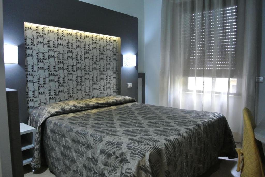 Postel nebo postele na pokoji v ubytování Hotel Dei Mille