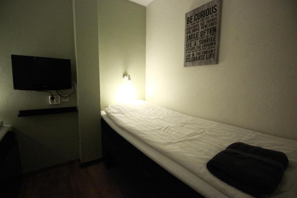 
Small Twin Room with Shared Bathroom - No Window
