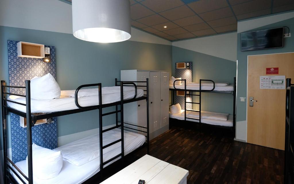 Postel nebo postele na pokoji v ubytování Singer109 Hostel, Hotel & Apartment
