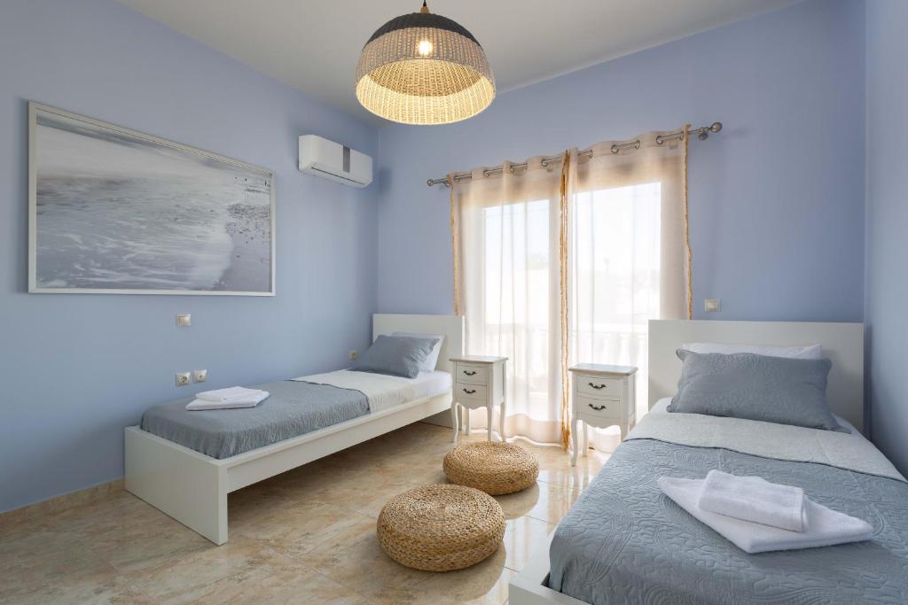 Postel nebo postele na pokoji v ubytování Evelyn Villa