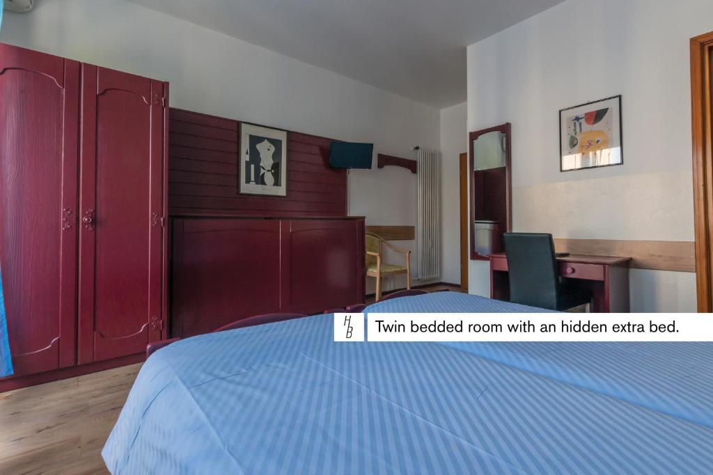 En eller flere senge i et værelse på Hotel Besso Lugano Center