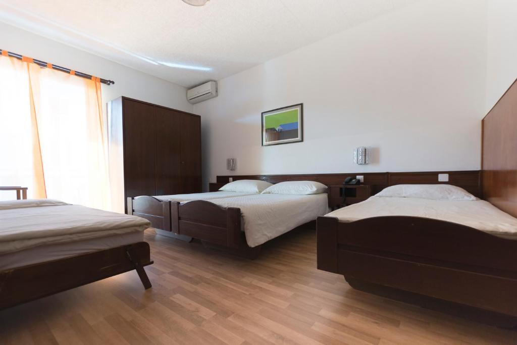 Cama o camas de una habitación en Hotel Besso Lugano Center