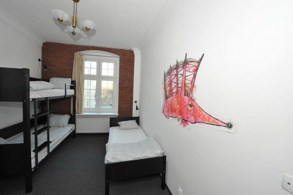 Postel nebo postele na pokoji v ubytování Hostel Wratislavia