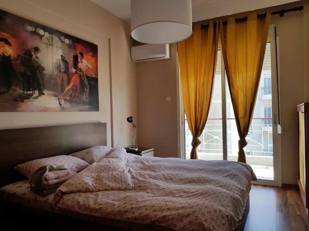 Ένα ή περισσότερα κρεβάτια σε δωμάτιο στο Top Floor Apartment