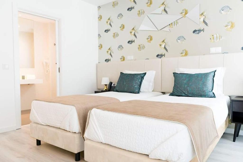 Postel nebo postele na pokoji v ubytování Hotel Magic