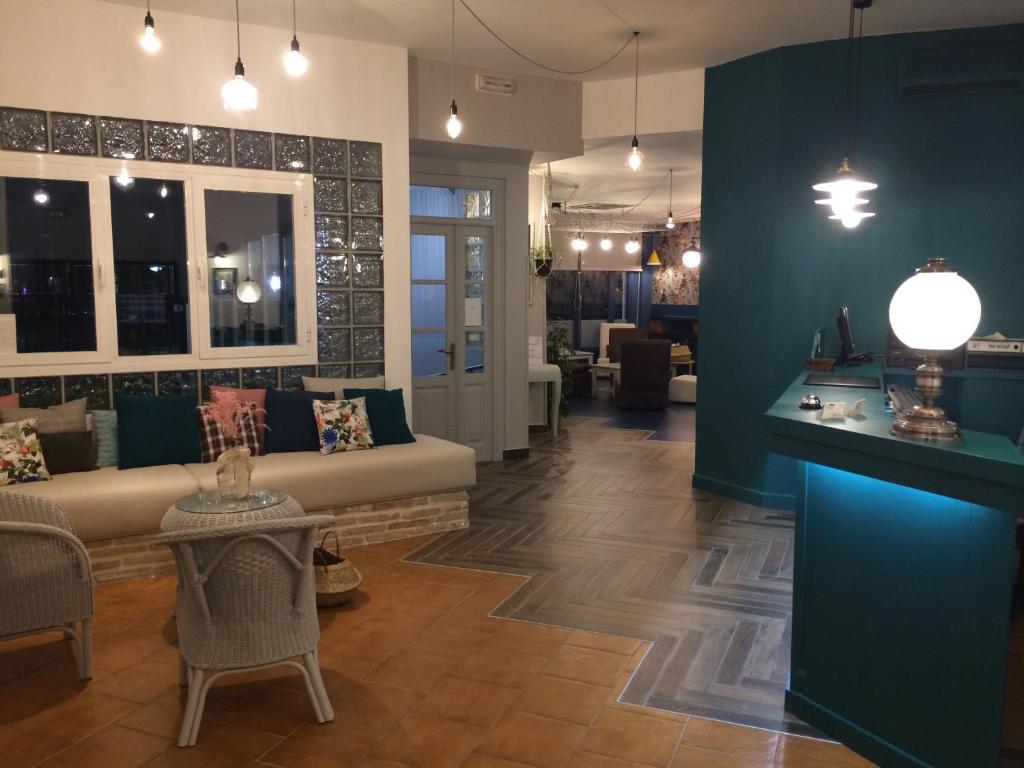 a living room with a couch and a table at Hotel Maestrazgo de Calatrava in Almagro