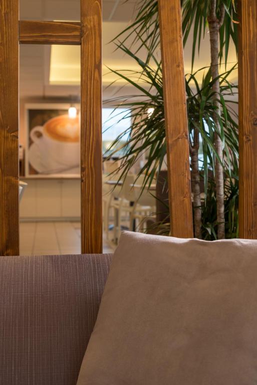 Posezení v ubytování Ace Hôtel Clermont Ferrand La Pardieu