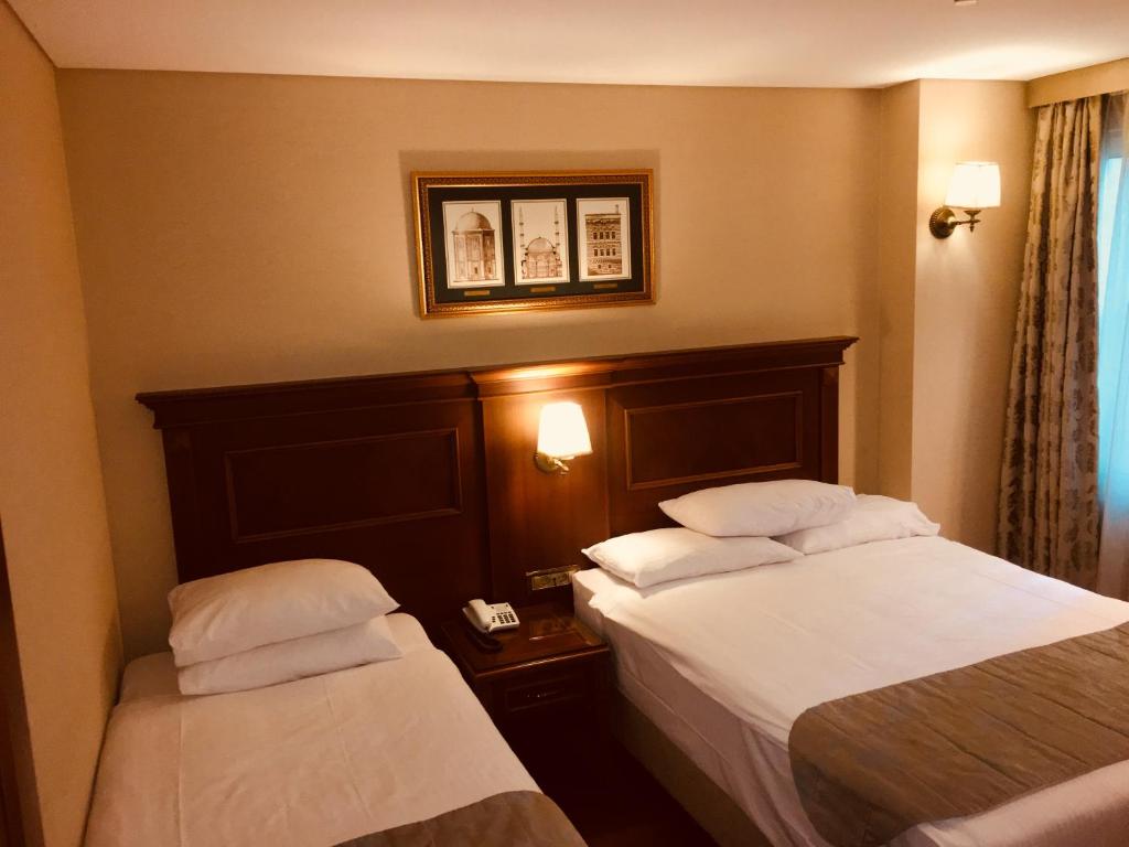 Cama ou camas em um quarto em Hotel Perula & SPA