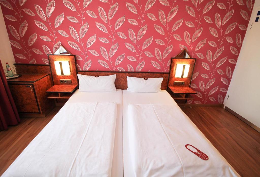 Cama ou camas em um quarto em Hotel Miramar am Römer