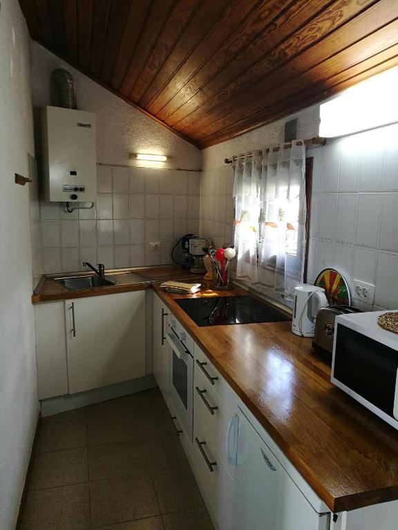 Kuchyň nebo kuchyňský kout v ubytování Apartments Finca El Rincón