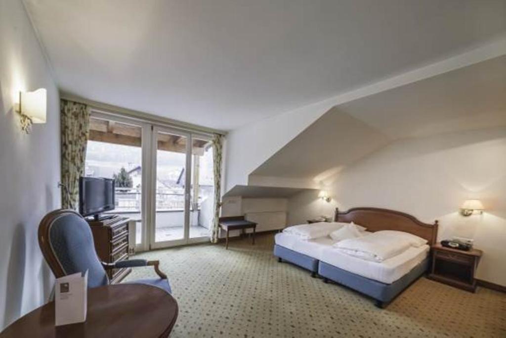 Postel nebo postele na pokoji v ubytování Boutique Hotel Am Park