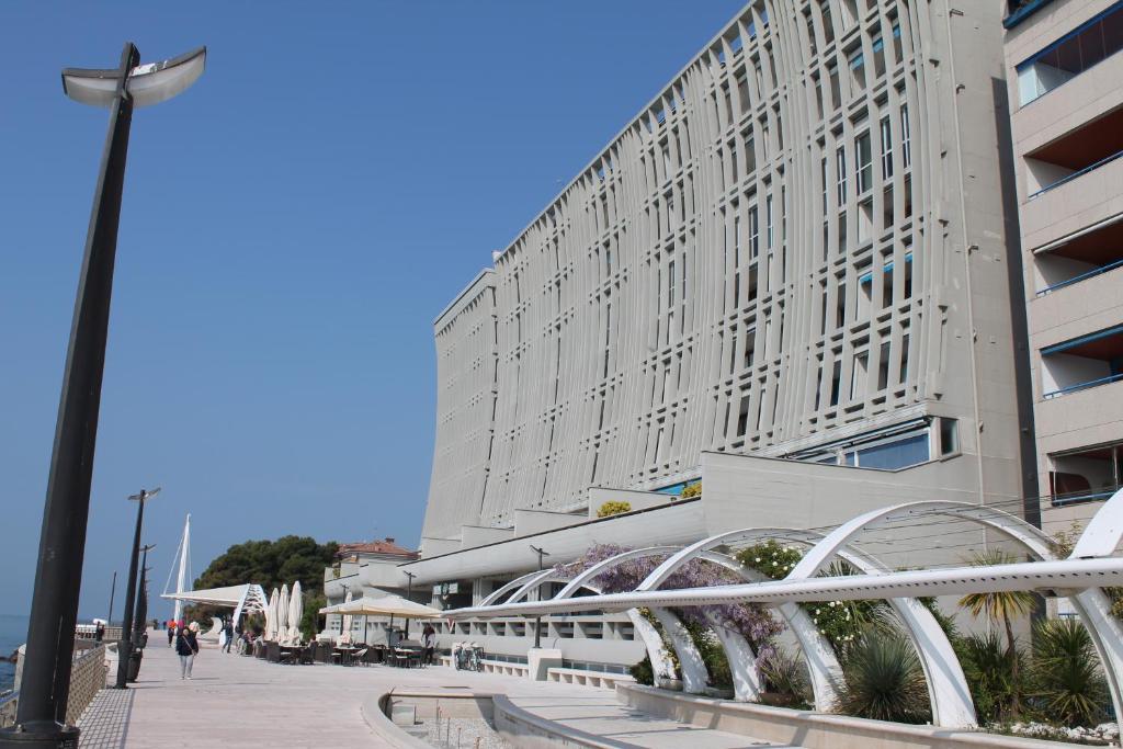 a large building with a street light in front of it at Zipser 23 in Grado