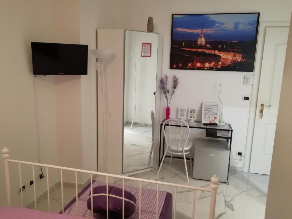 TV a/nebo společenská místnost v ubytování B&B Casa Nizza