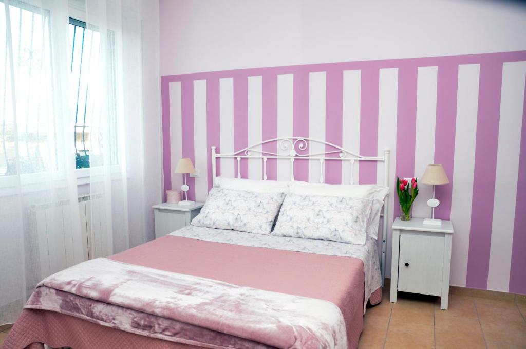 Katil atau katil-katil dalam bilik di IL CILIEGIO Affittacamere