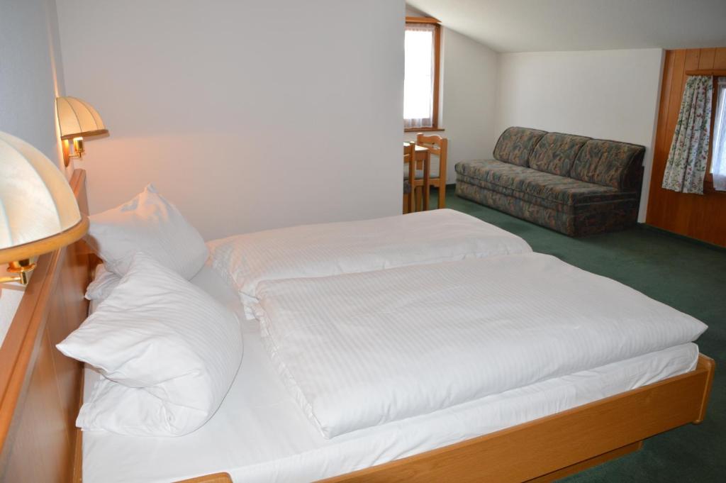 Postel nebo postele na pokoji v ubytování Hotel Seeblick