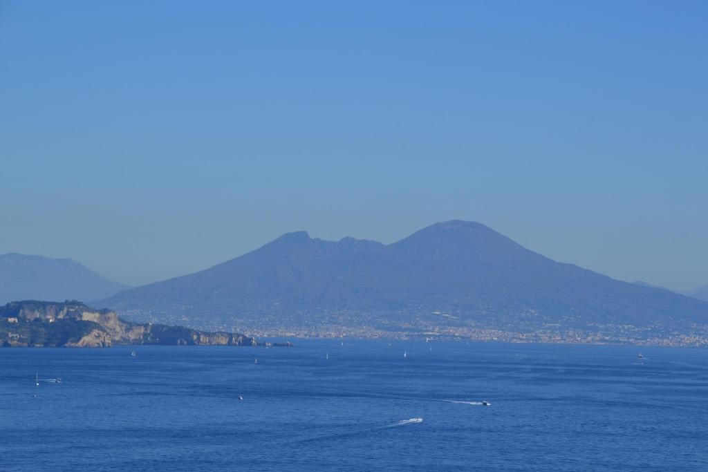 a large body of water with mountains in the background at Terra Murata Boutique b&b in Procida