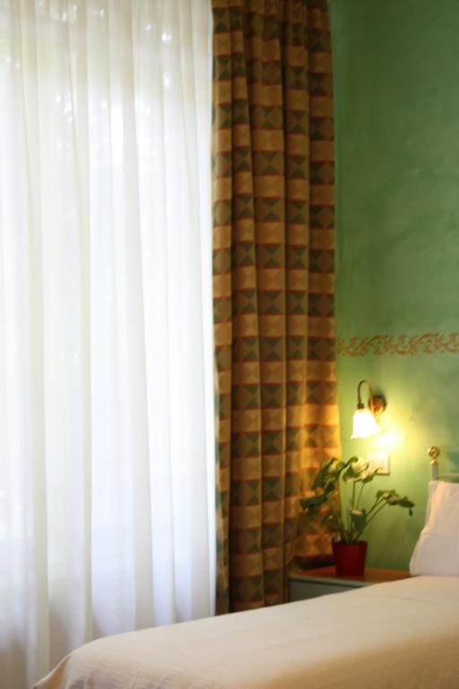 Postel nebo postele na pokoji v ubytování Park Hotel