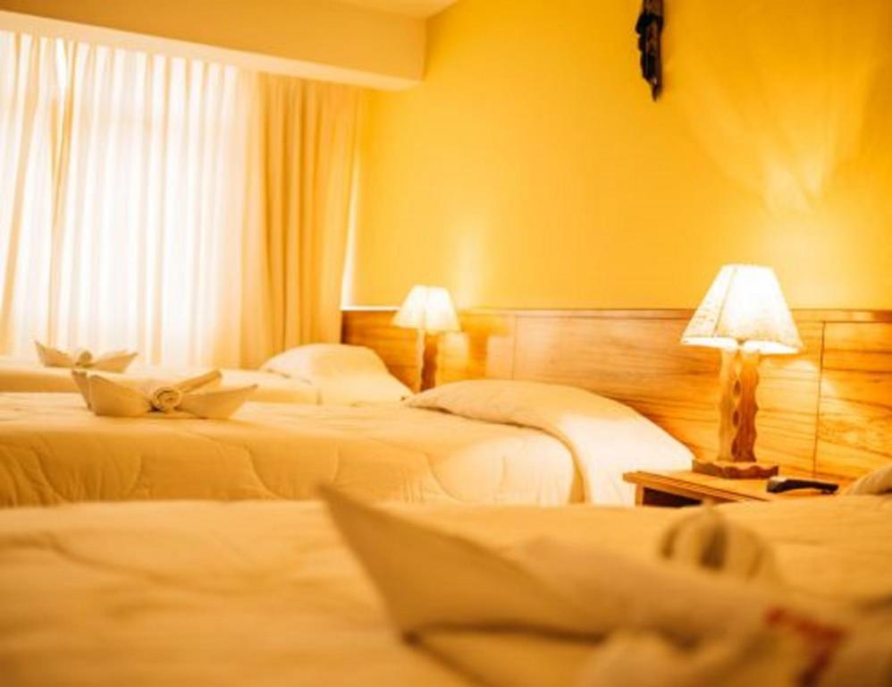 Postel nebo postele na pokoji v ubytování Kaaro Hotel El Buho