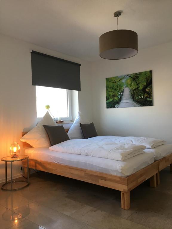 a bedroom with a large bed in a room at City Apartment in Nuremberg