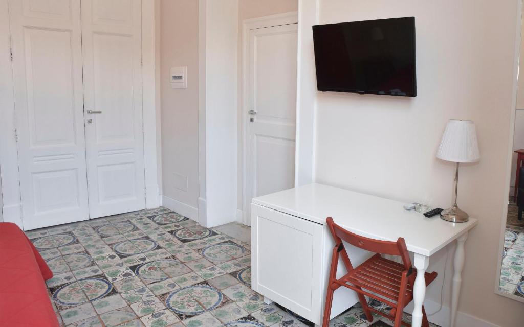 Televízia a/alebo spoločenská miestnosť v ubytovaní Alta Marea B&B