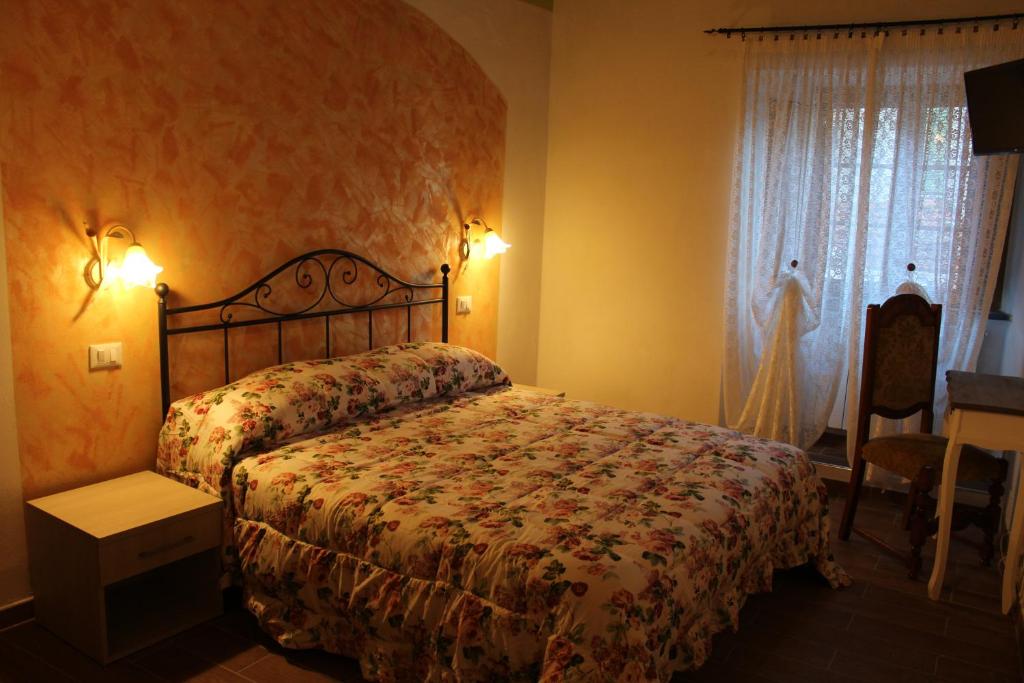 Postel nebo postele na pokoji v ubytování Il Castellaro