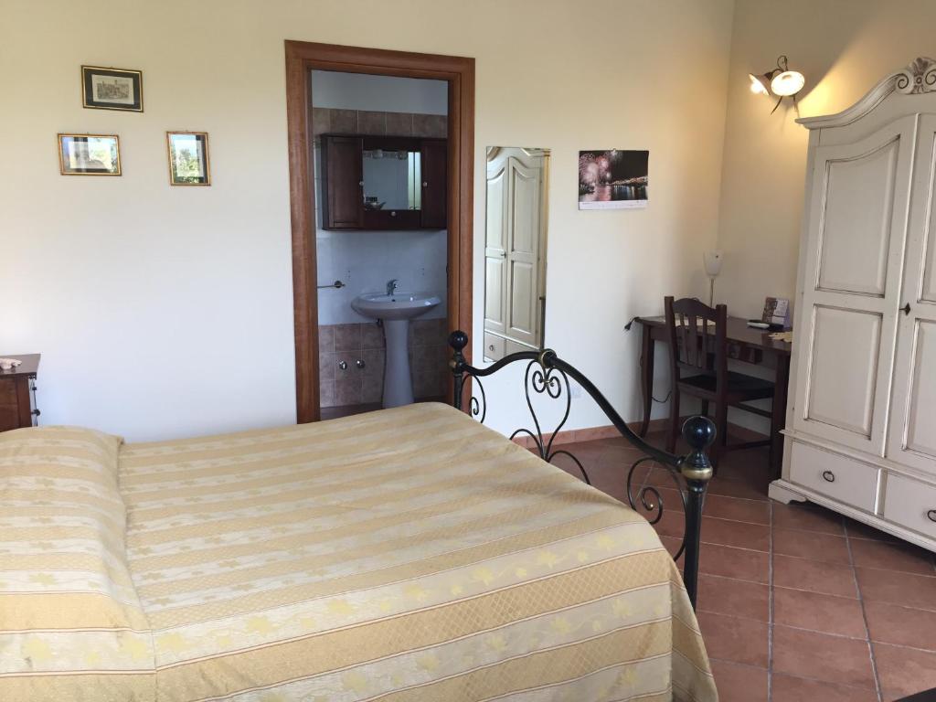 Postel nebo postele na pokoji v ubytování Agriturismo Arangèa