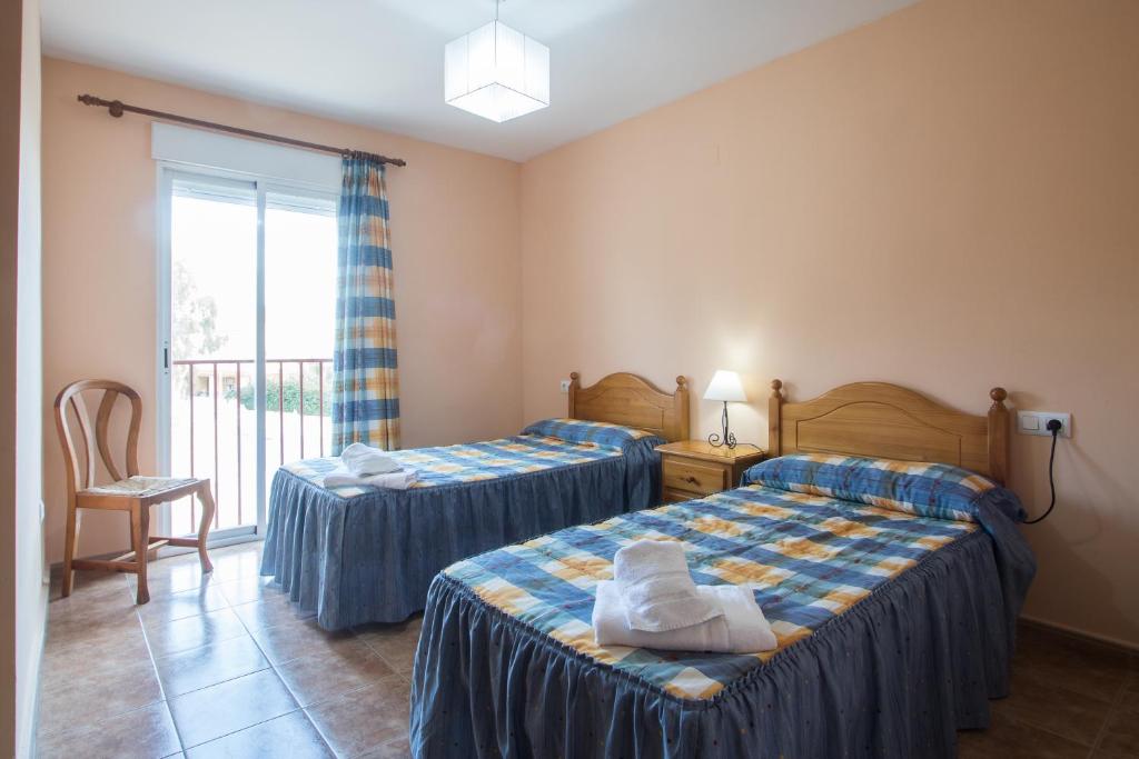 Postel nebo postele na pokoji v ubytování Apartamentos Nicaragua