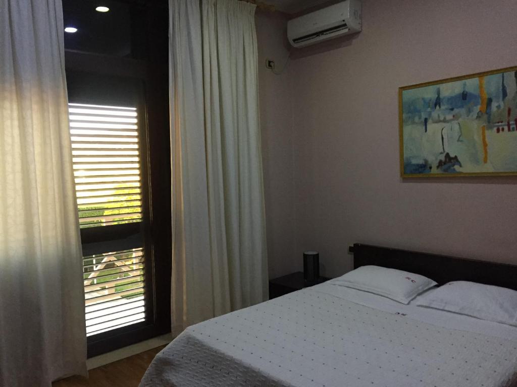 Postel nebo postele na pokoji v ubytování Hotel Colombo Elbasan