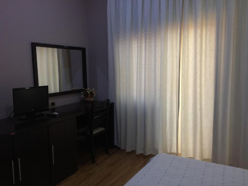 Postel nebo postele na pokoji v ubytování Hotel Colombo Elbasan