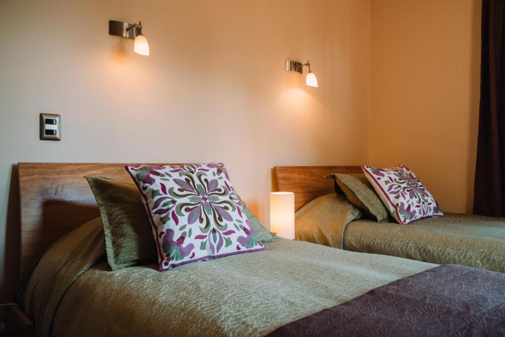 Uma cama ou camas num quarto em Hotel Chalet Valluga