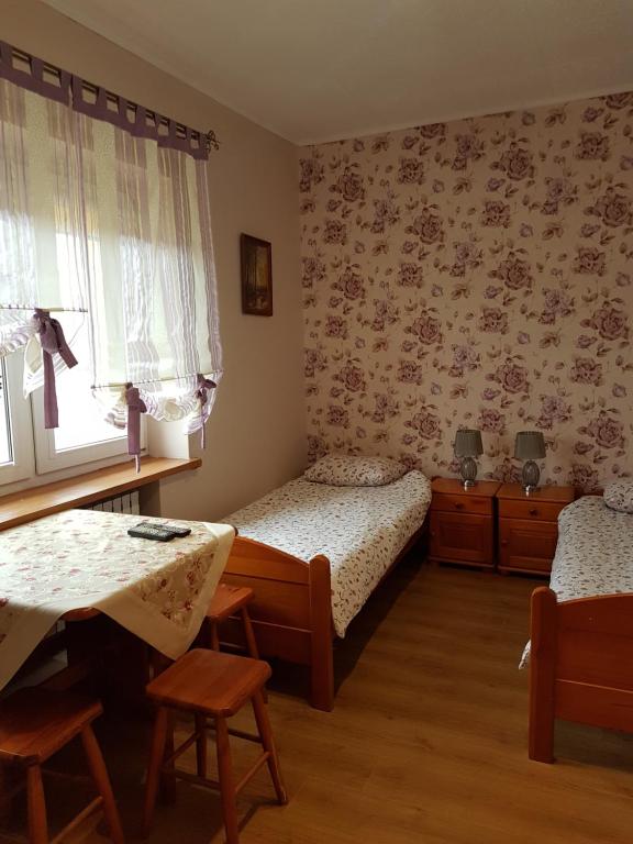Posteľ alebo postele v izbe v ubytovaní Pokoje Adriano