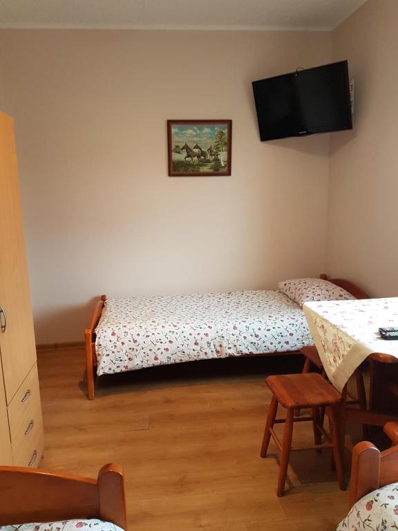 Posteľ alebo postele v izbe v ubytovaní Pokoje Adriano