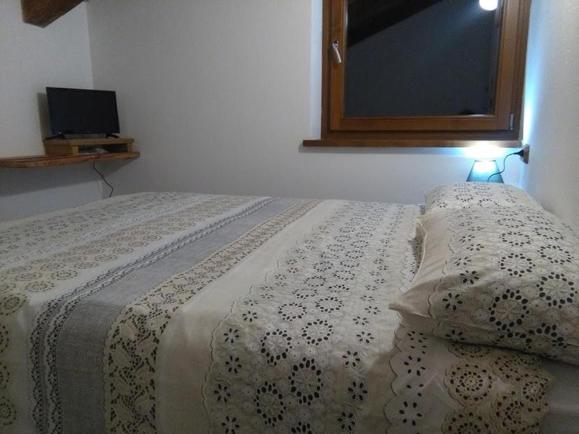 Postel nebo postele na pokoji v ubytování Appartamento Sole