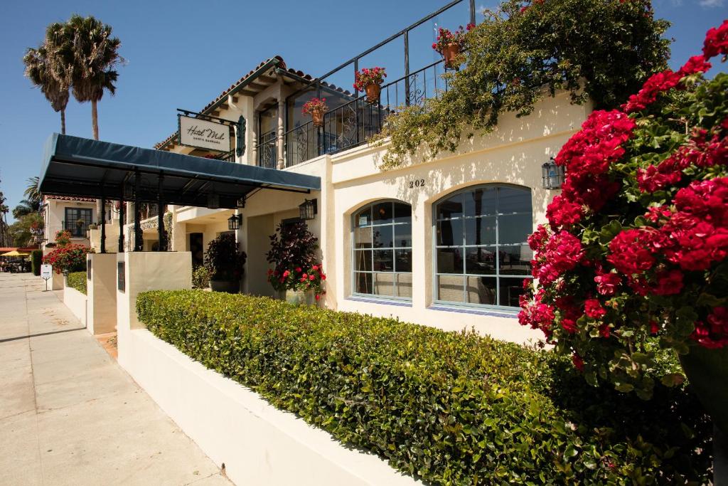 a building with flowers on the side of it at The Milo in Santa Barbara