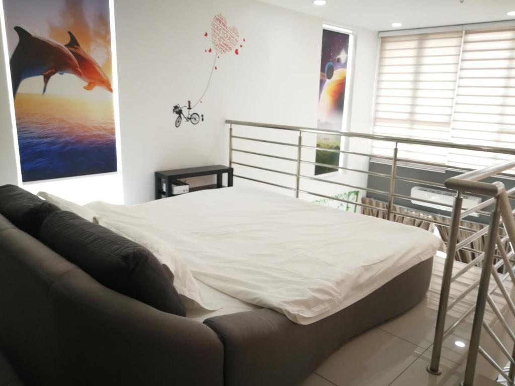 a bedroom with a bed in a room at De Centrum Duplex Apartment near Bangi, Kajang in Kajang
