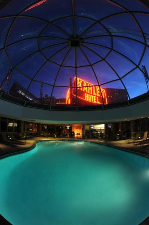 a large swimming pool in a building with a dome at Kahler Grand Hotel in Rochester