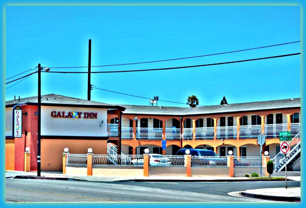 a building with a sign on the side of a street at Galaxy Inn in Los Angeles