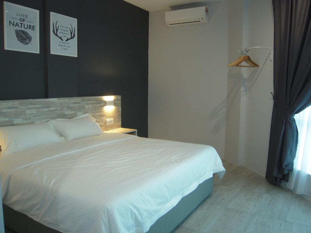 Postel nebo postele na pokoji v ubytování L Hotel