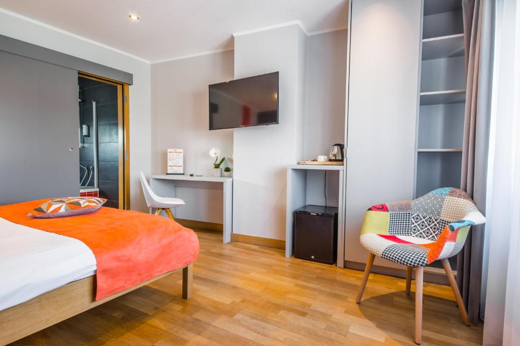 Postel nebo postele na pokoji v ubytování Mandarina Hotel Luxembourg Strassen