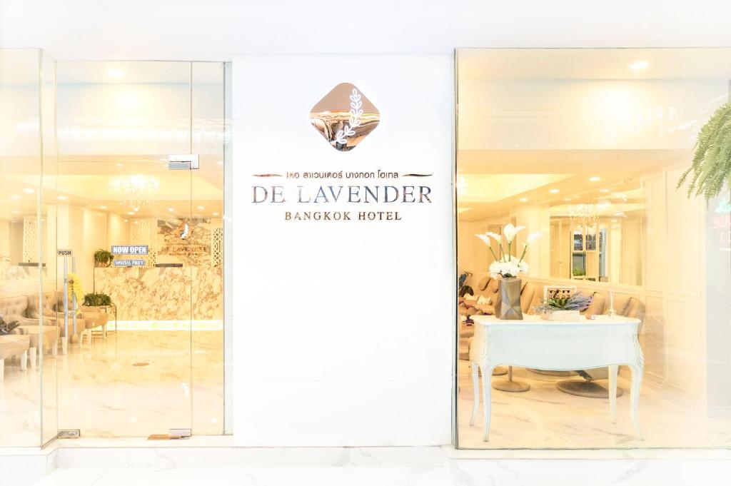 a glass door with a sign that reads de lavender banquet hotel at De Lavender Bangkok Hotel in Bangkok