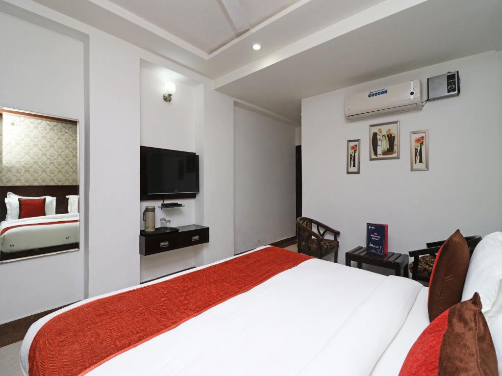 Postel nebo postele na pokoji v ubytování Hotel Samovar by Goyal Hotel