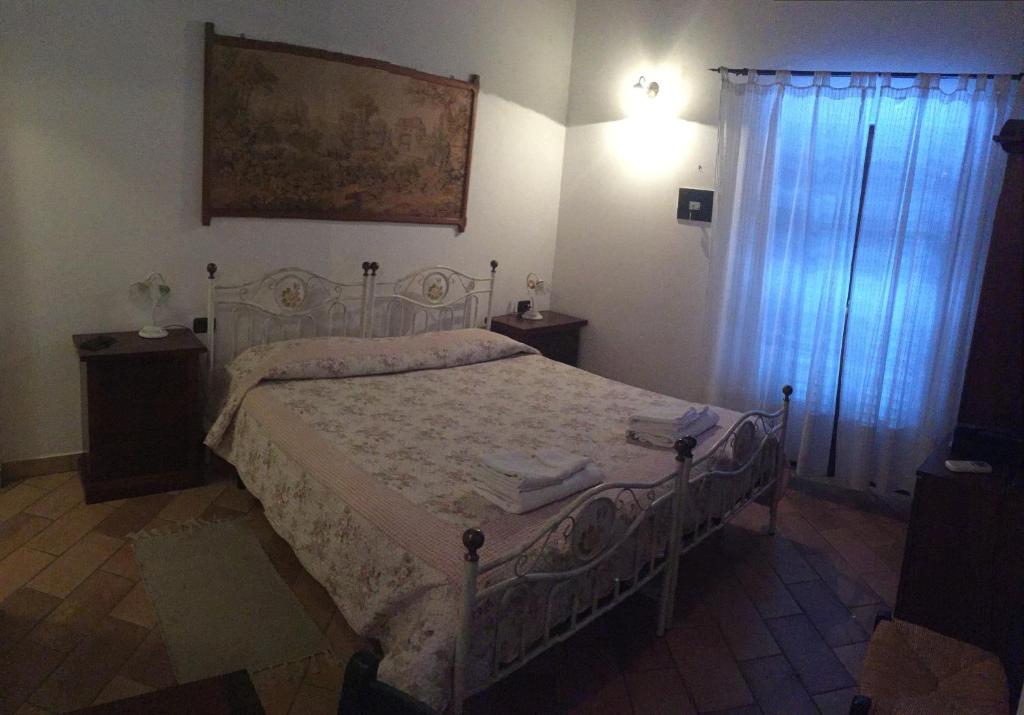Postel nebo postele na pokoji v ubytování Il Portico